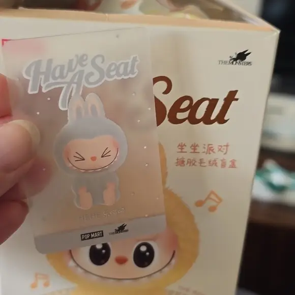 Close-up of a Hehe character card showing foil edge and crisp typography