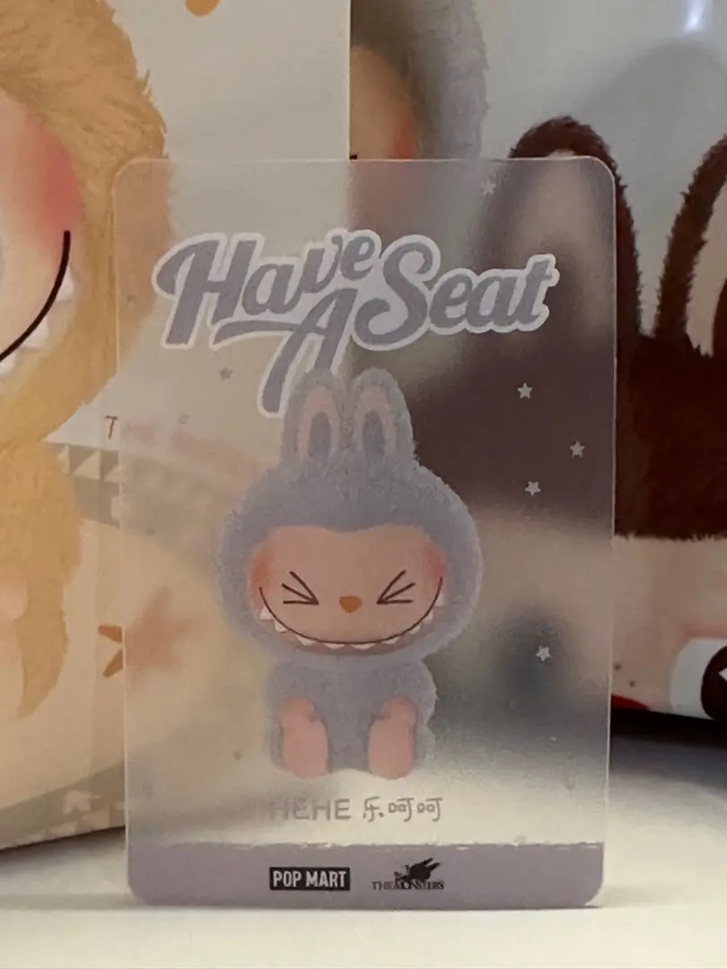 Close-up of a Hehe character card showing foil edge and crisp typography