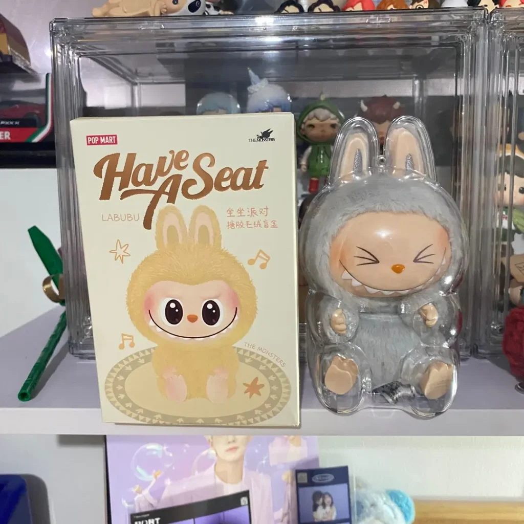 Hehe Labubu in a dust-proof acrylic case under neutral lighting