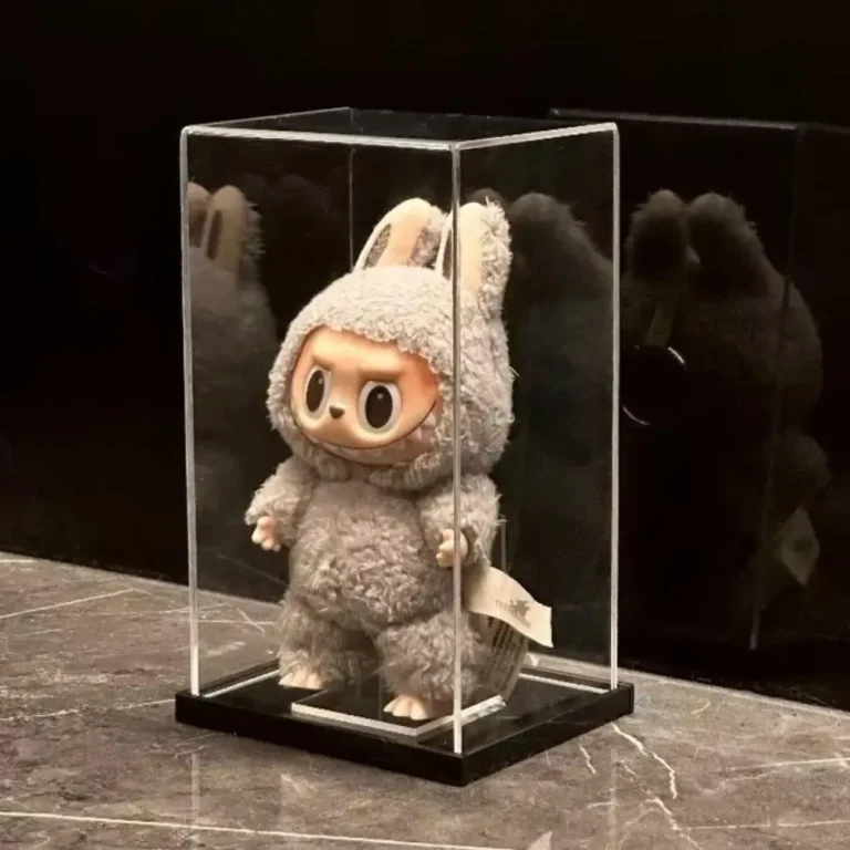 Sesame Bean Labubu safely displayed in a dust-proof acrylic case with soft lighting